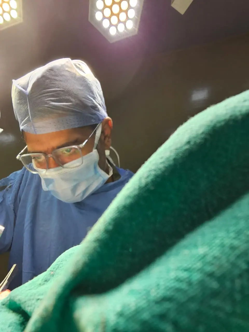 Dr. Ankit Kayal performing a precision urological surgery in the operating room